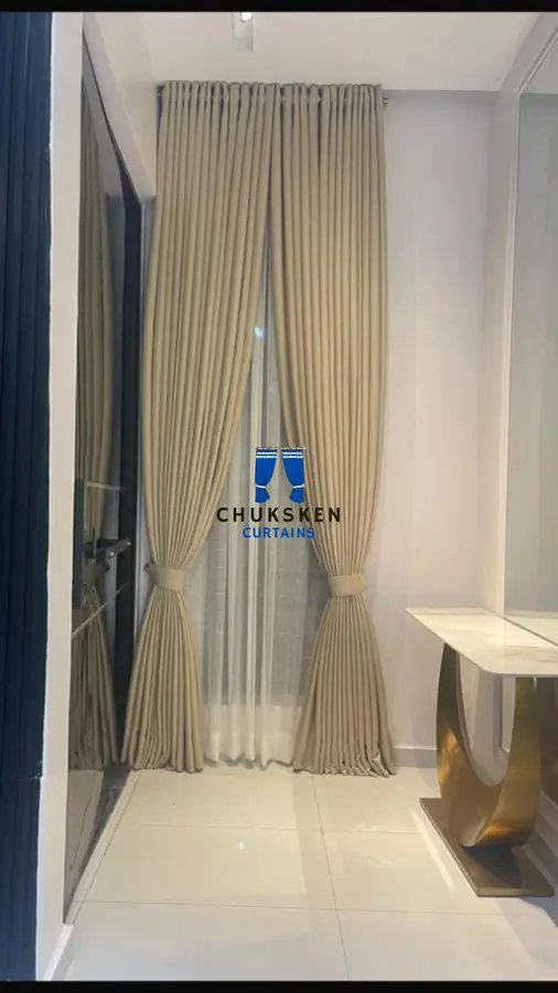 Beige curtains in a home entryway
