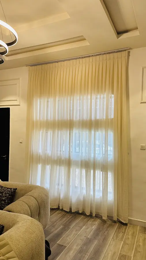 Warm toned sheer curtains in a living room